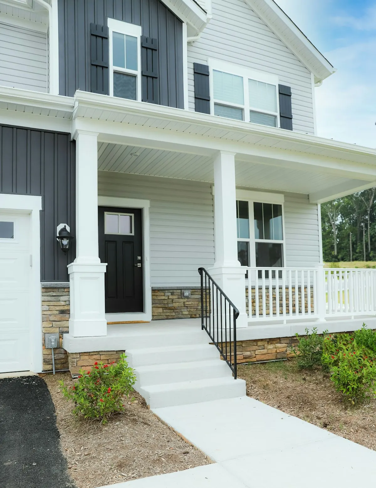 White front porch with a straight access path