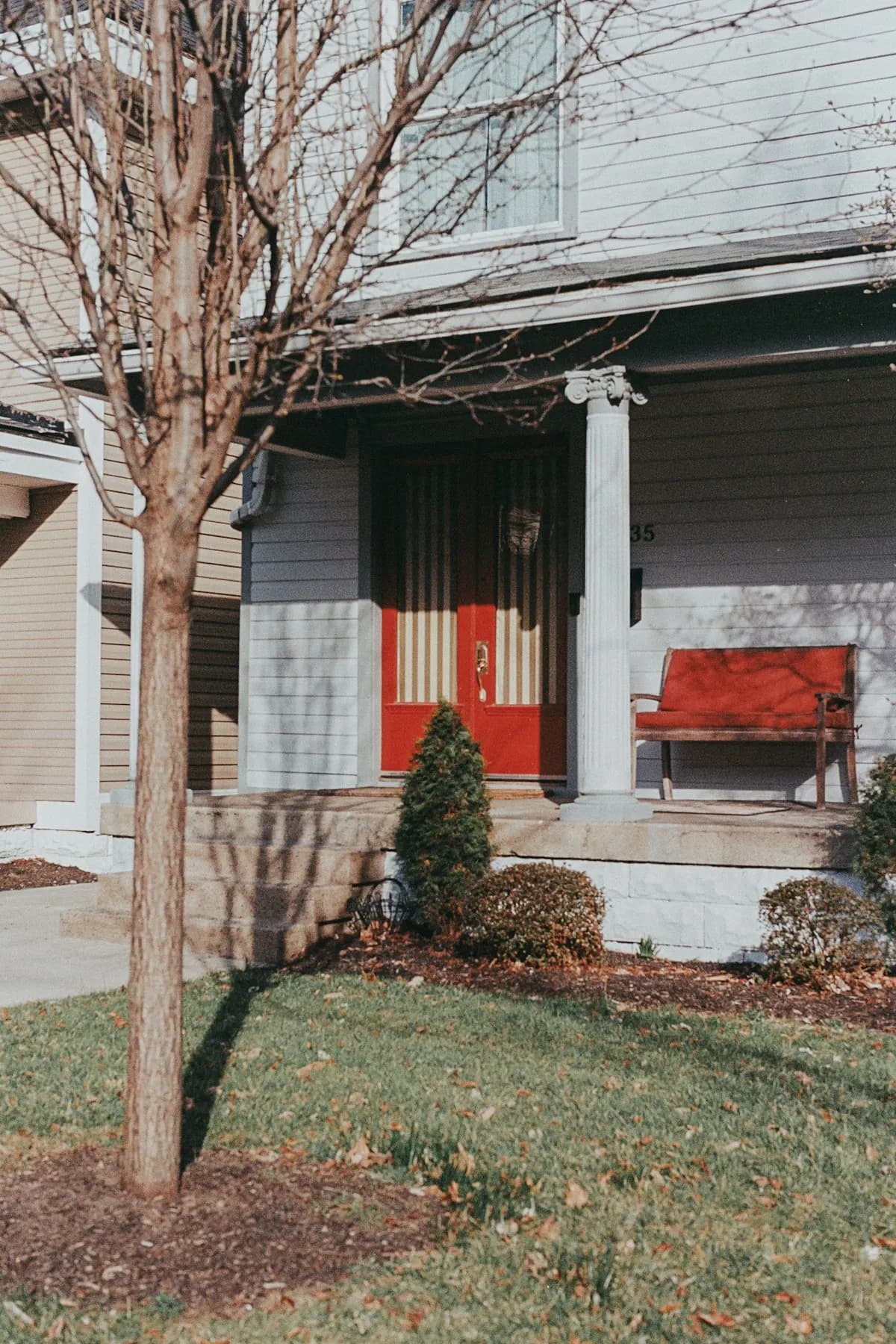 Covered front porch on a blue house