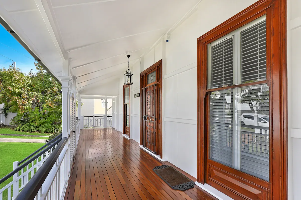 Long covered porch with polished timber boards
